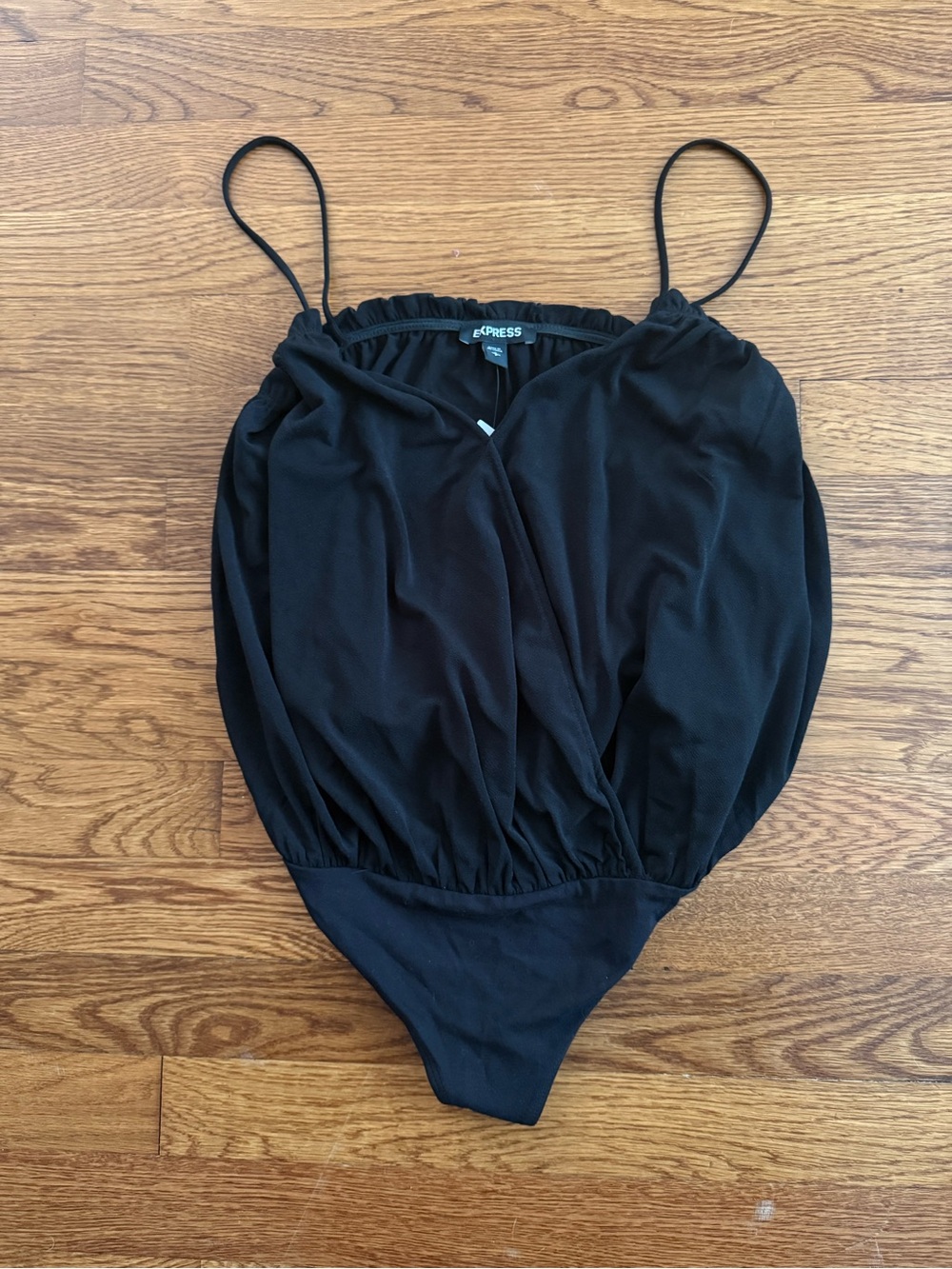NWT size small. Express Black women’s Spaghetti Strap One-Piece Bodysuit